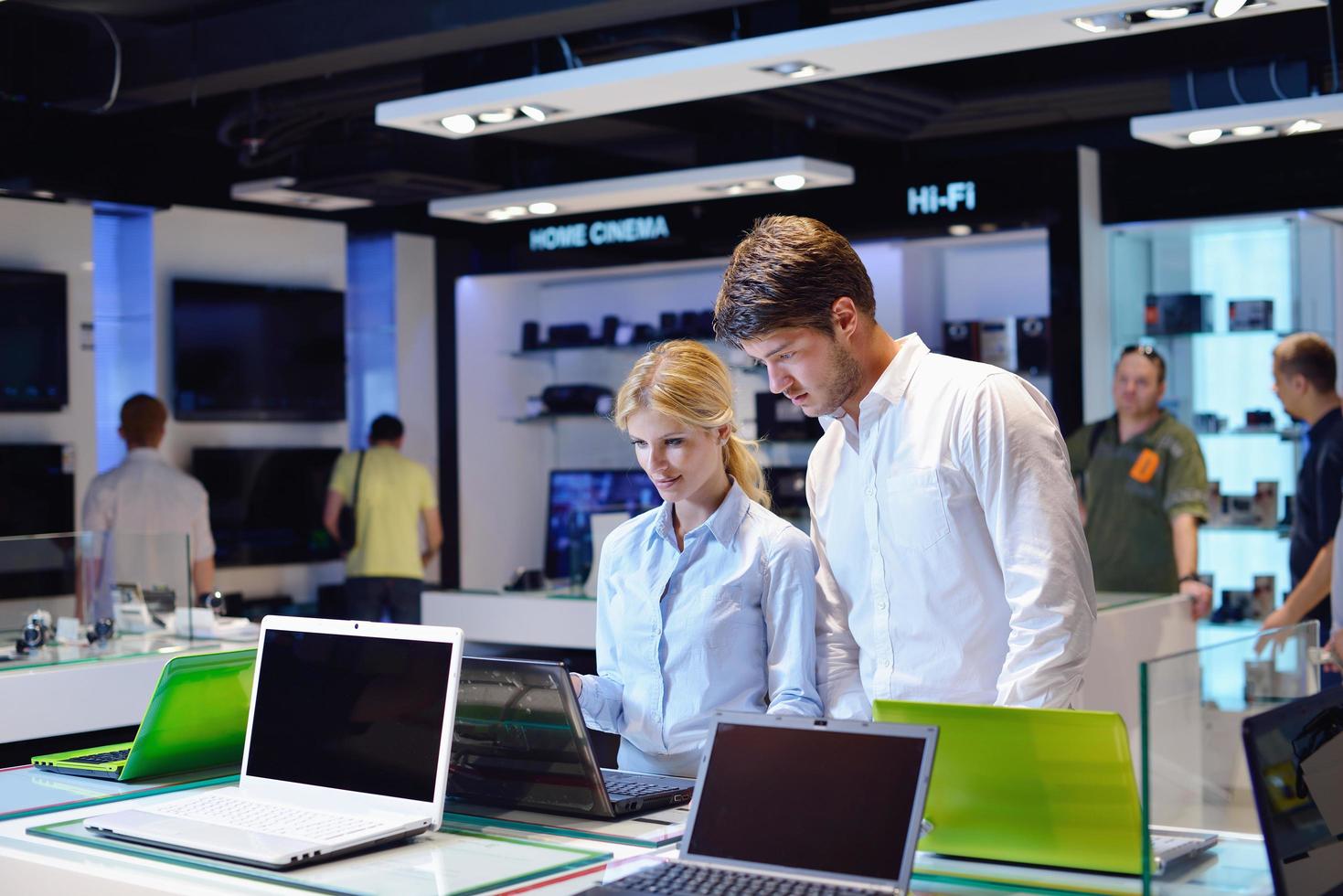 People in electronics store photo