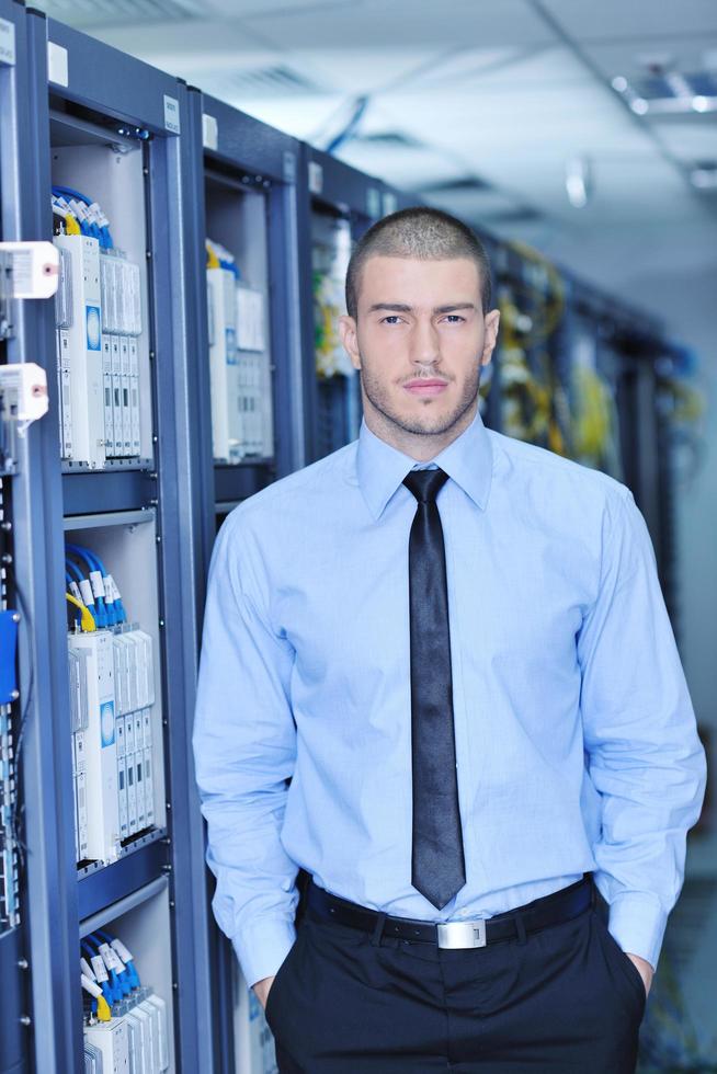 young it engeneer in datacenter server room photo