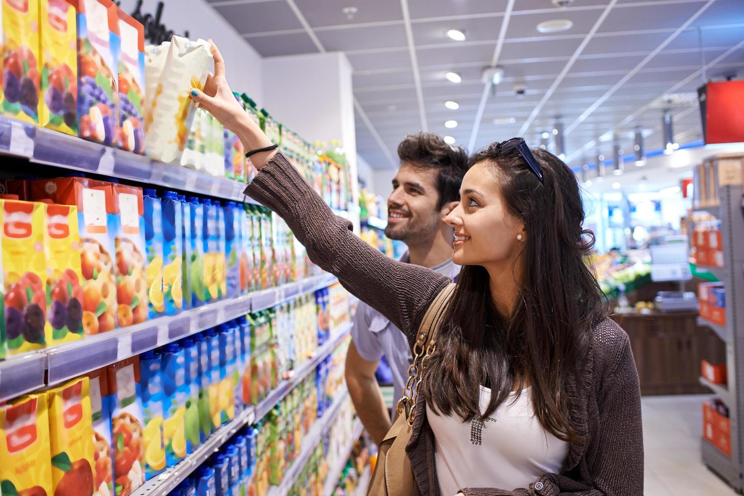 couple shopping in a supermarket photo