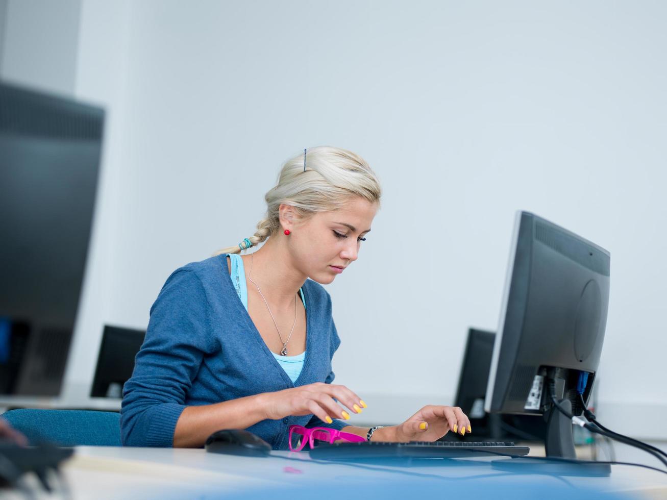 student woman in computer lab classroom photo