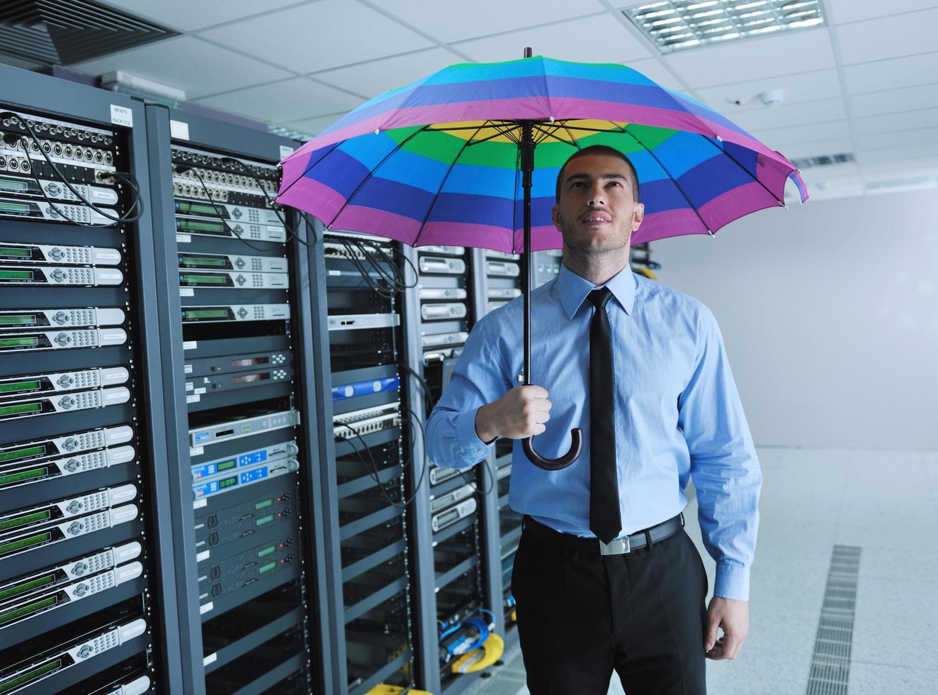 businessman hold umbrella in server room 11926626 Stock Photo at Vecteezy