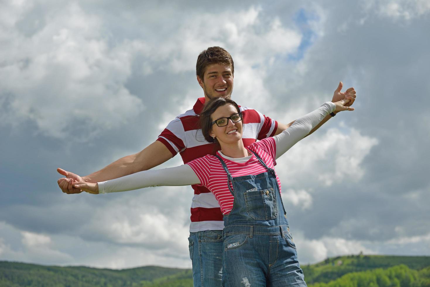 Portrait of romantic young couple smiling together outdoor photo