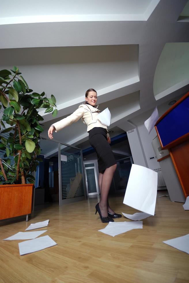 .happy businesswoman throwing documents photo