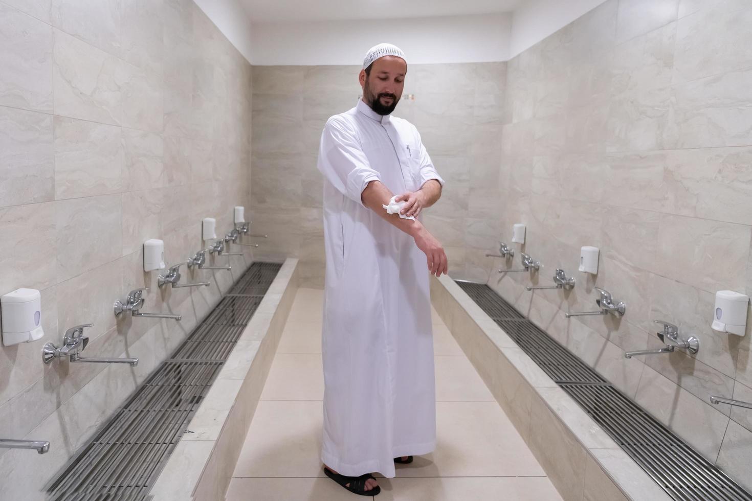 a portrait of a man in abdesthana using a towel photo