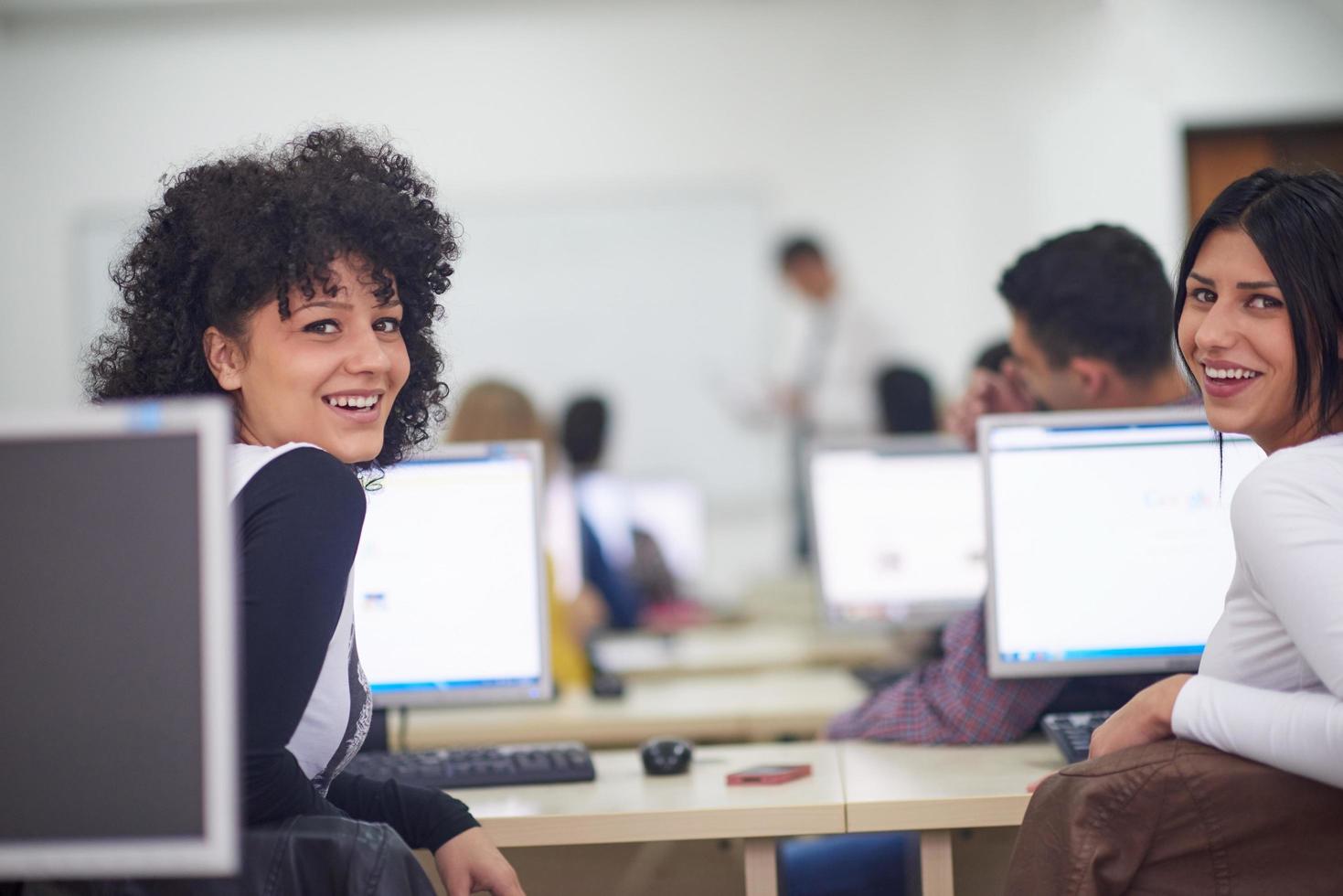 students group in computer lab classroom photo