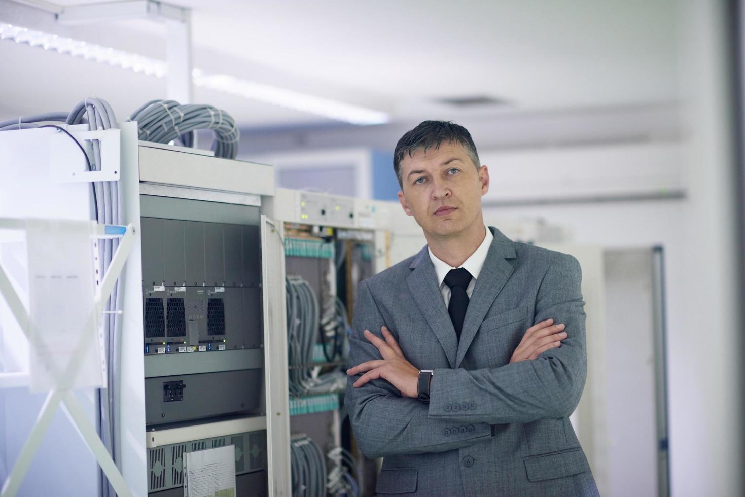 network engineer working in  server room photo