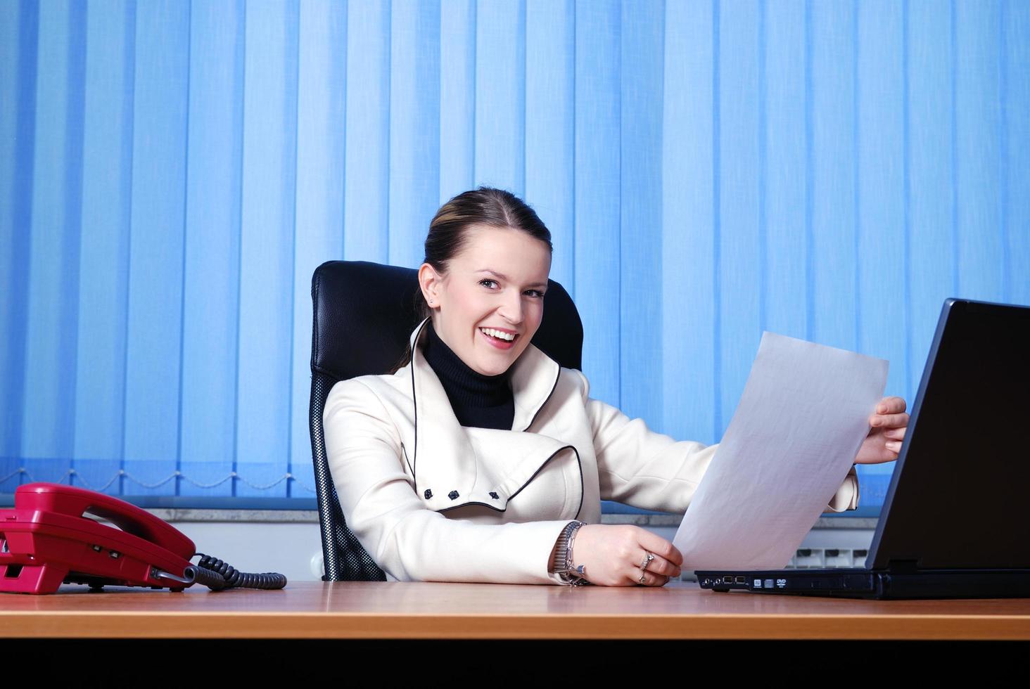 .young businesswoman reading documents photo