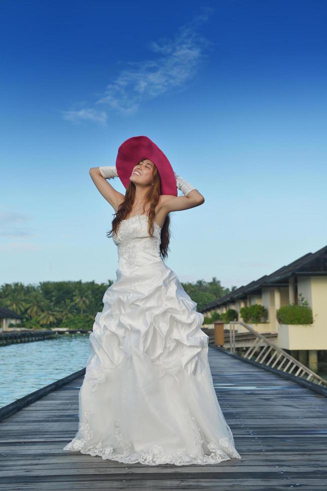 asian bride on beach photo