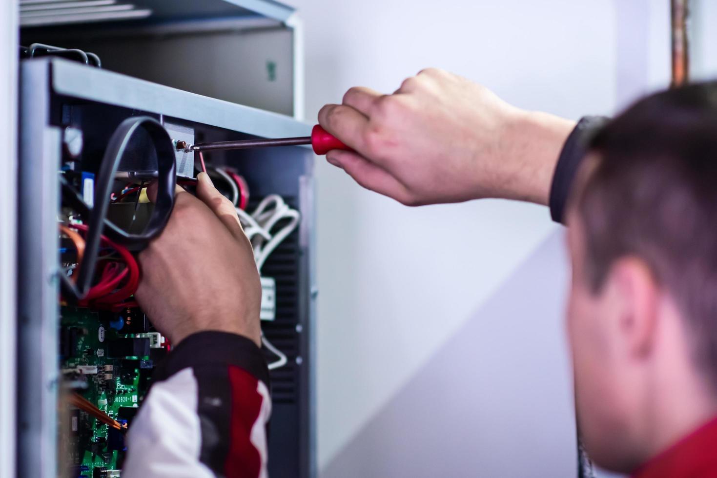 electrician engineer working with electric cable wires photo