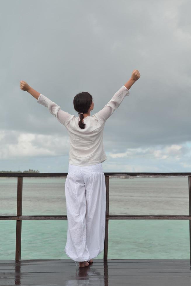 young woman relax on cloudy summer day photo