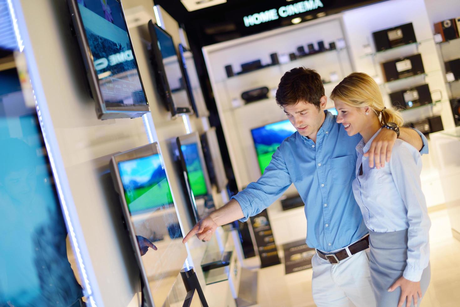 People in electronics store photo