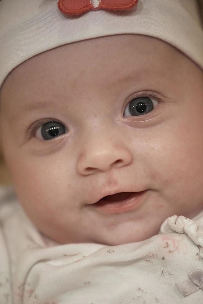 portrait of happy newborn little baby smilling photo