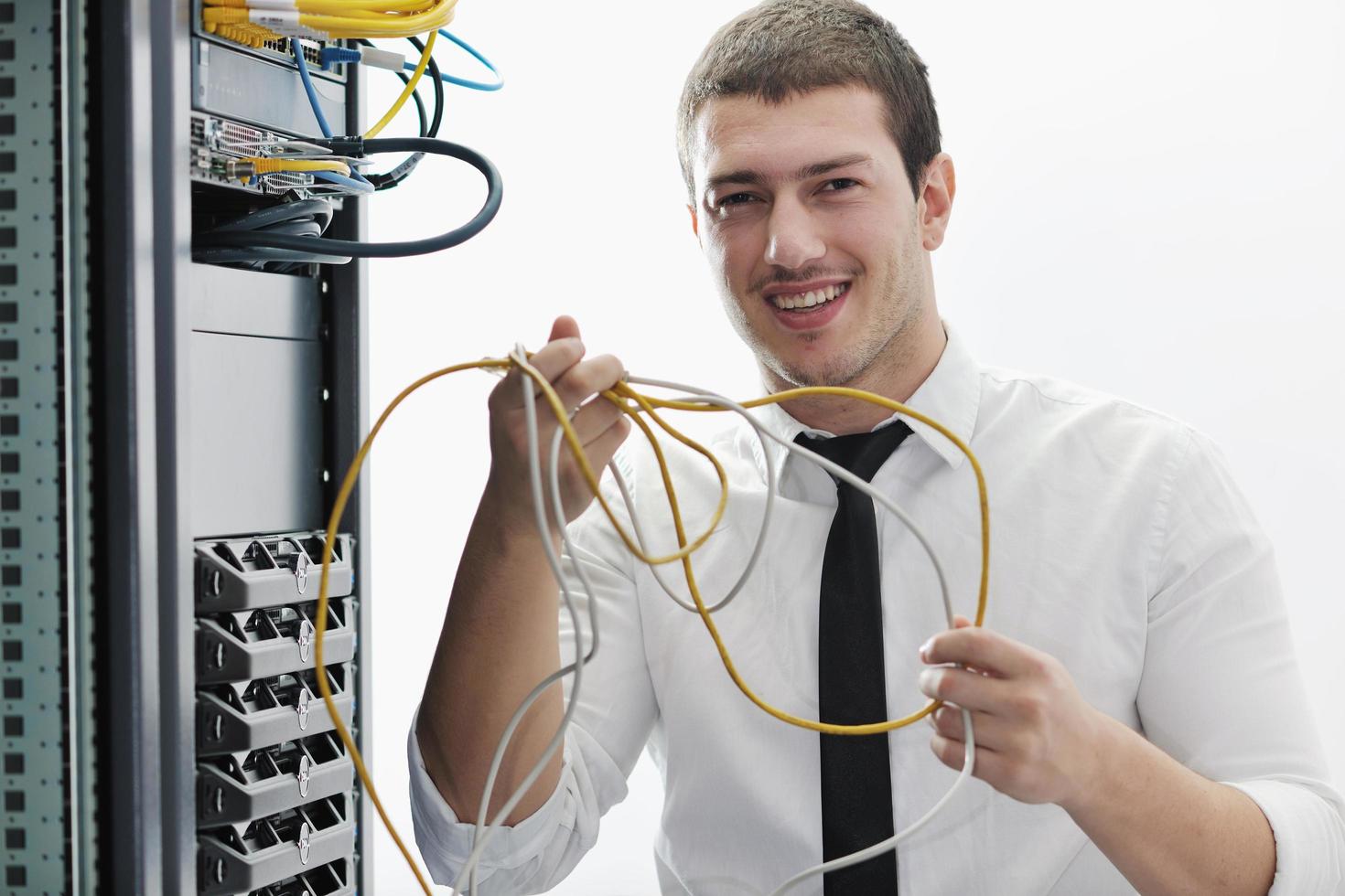young it engeneer in datacenter server room photo