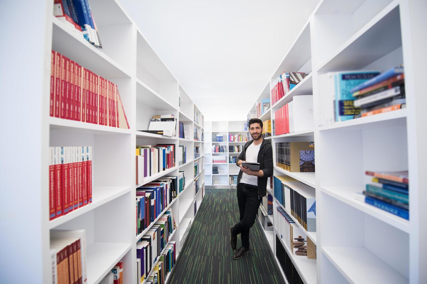 student with tablet in library photo