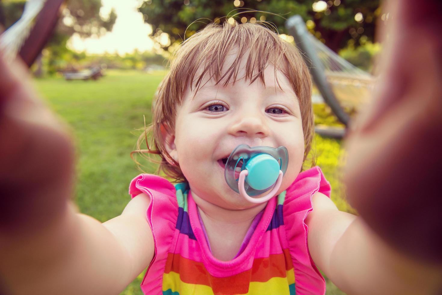 little girl spending time at backyard photo