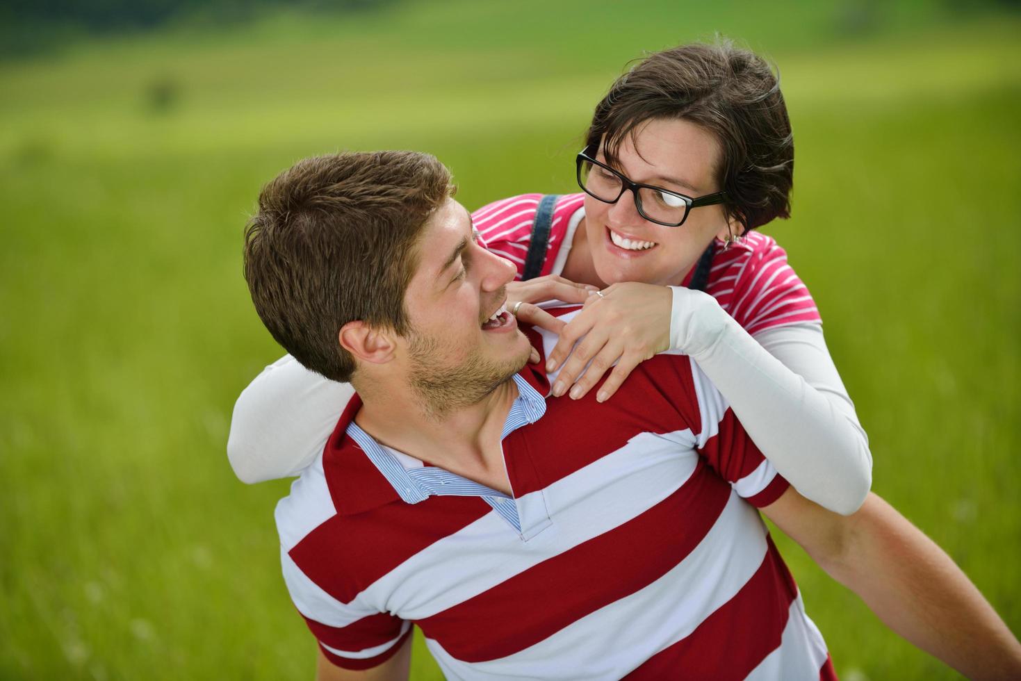 Portrait of romantic young couple smiling together outdoor photo