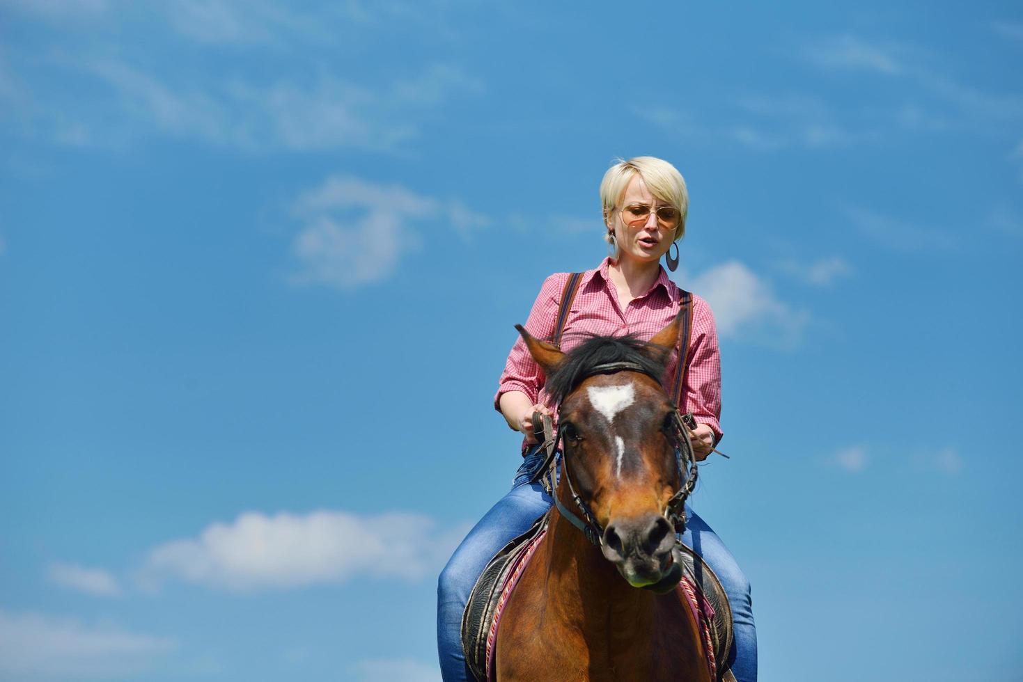 happy woman  on  horse photo