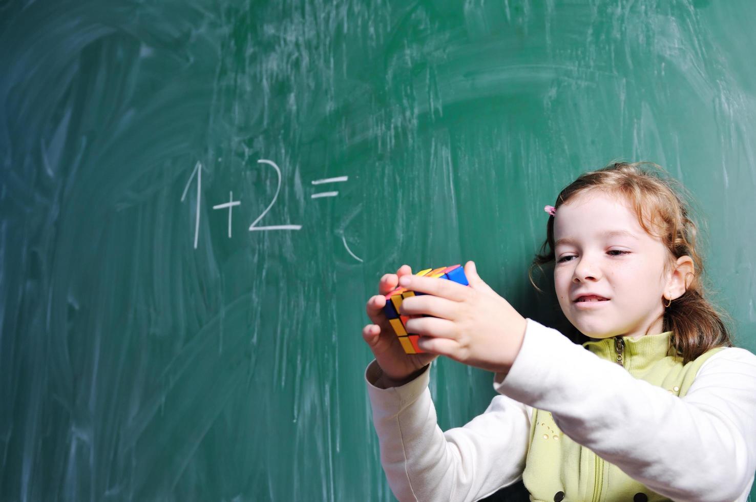 happy school girl on math classes photo