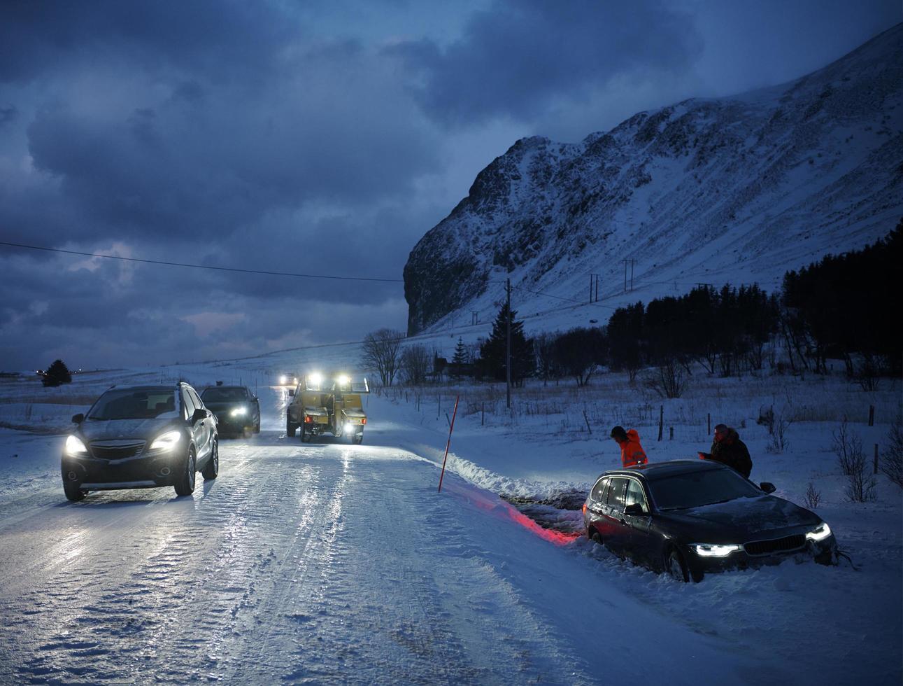 Car being towed after accident in snow storm photo