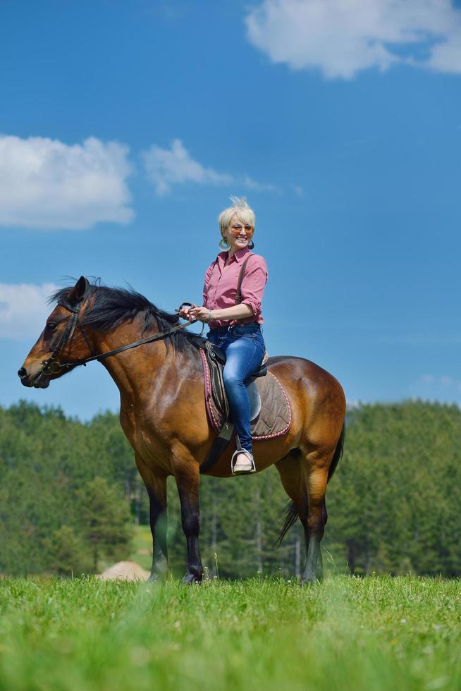 happy woman  on  horse photo