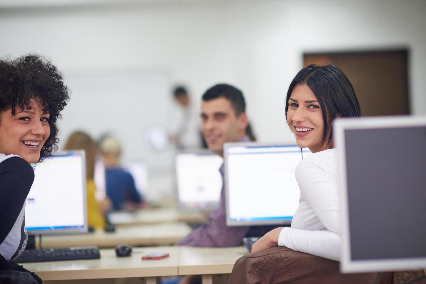 students group in computer lab classroom photo