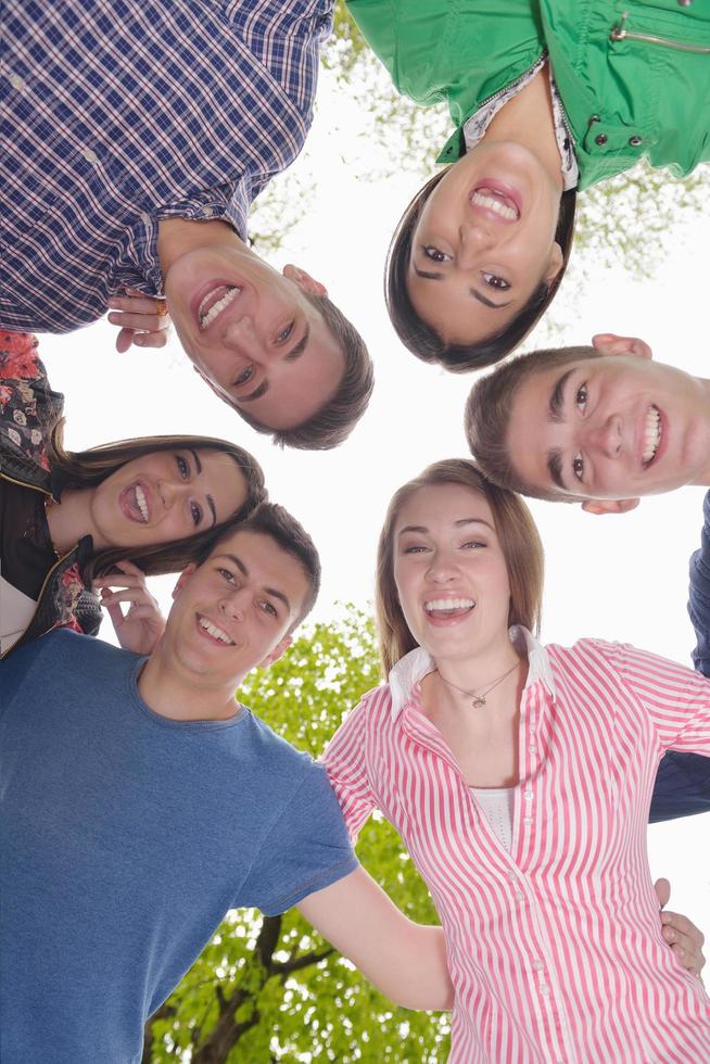 young friends staying together outdoor in the park photo