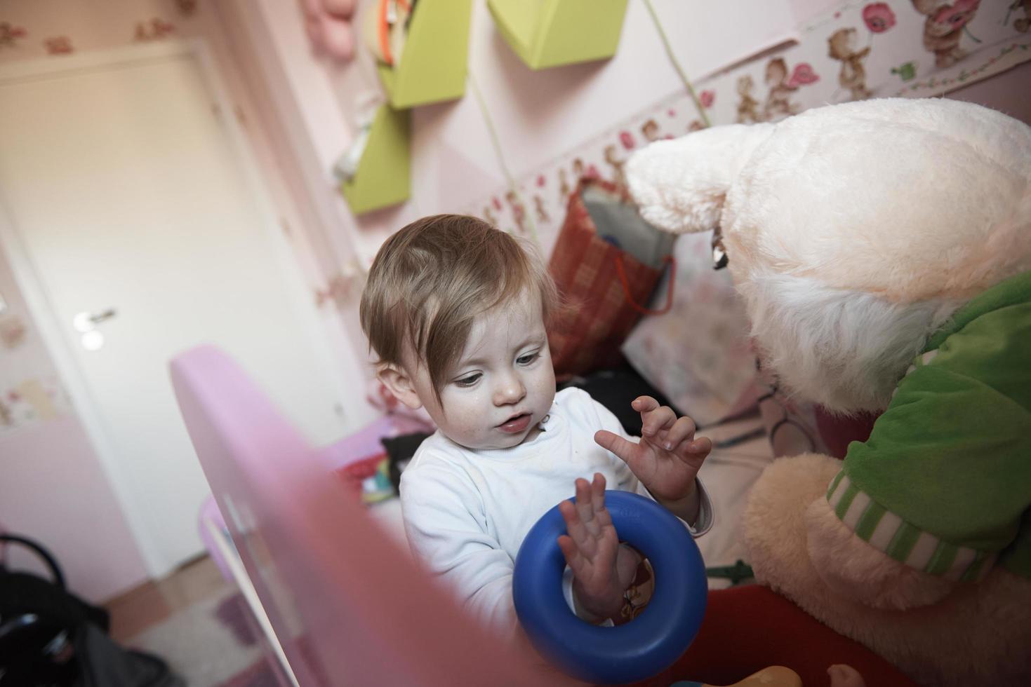 cute  little one year old baby and making first steps photo