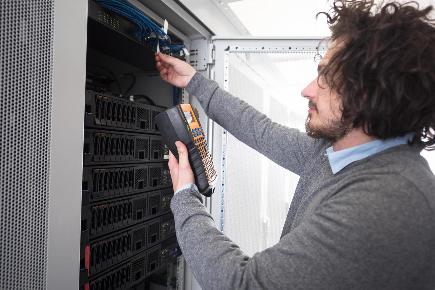 technician using digital cable analyzer photo