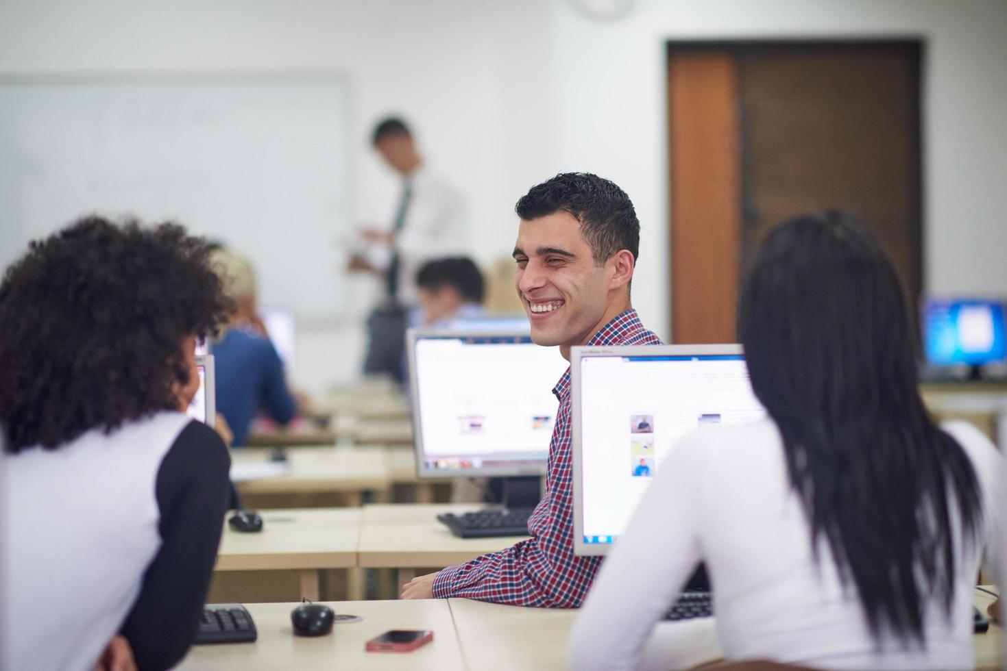 students group in computer lab classroom photo
