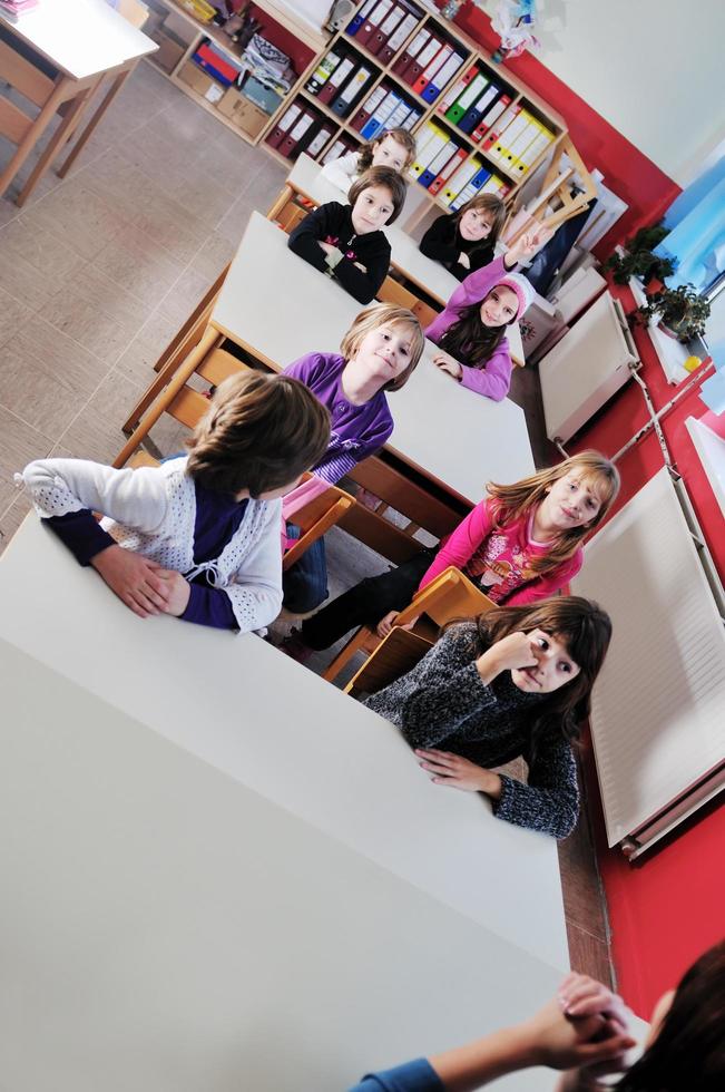 happy teacher in  school classroom photo