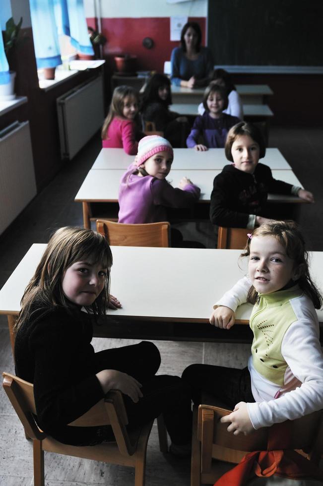 happy teacher in  school classroom photo