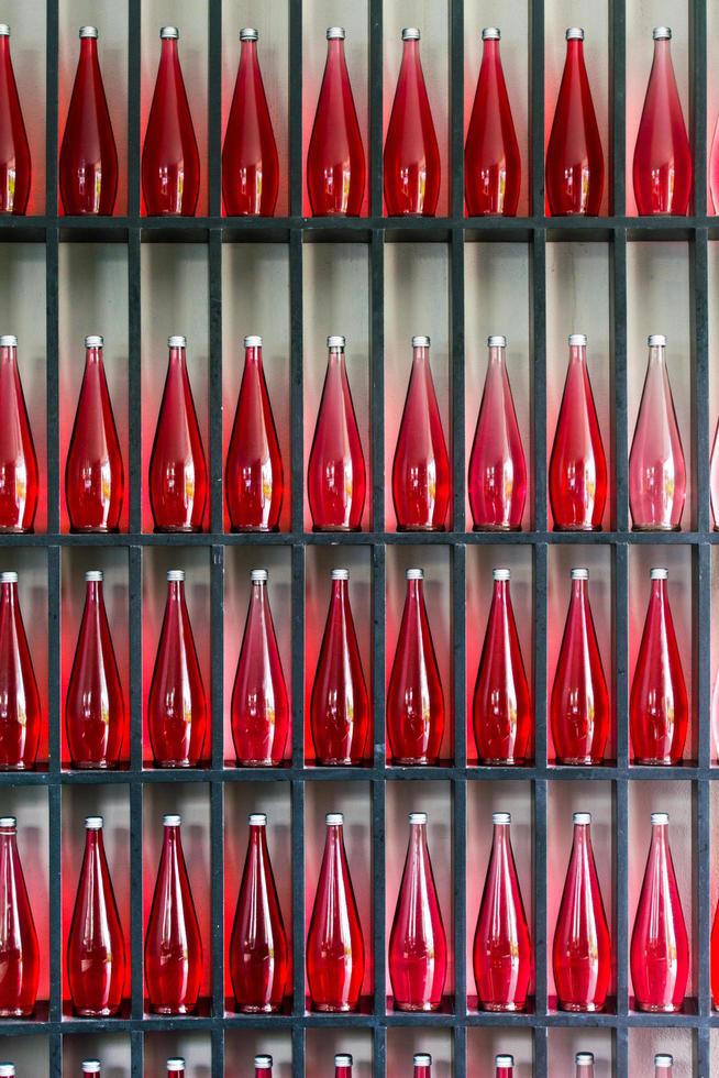 bottles of red juice in modern restaurant photo