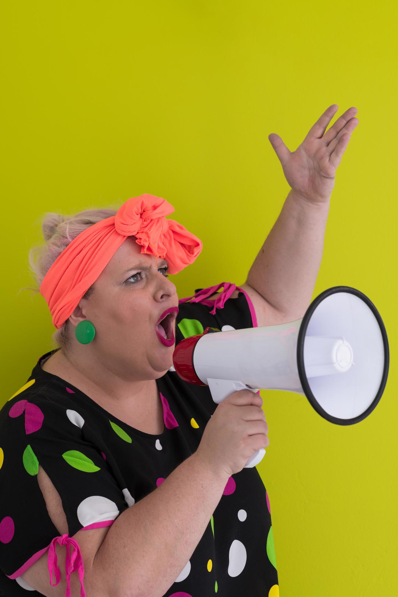 Funny plus size woman woman posing isolated on pastel green background