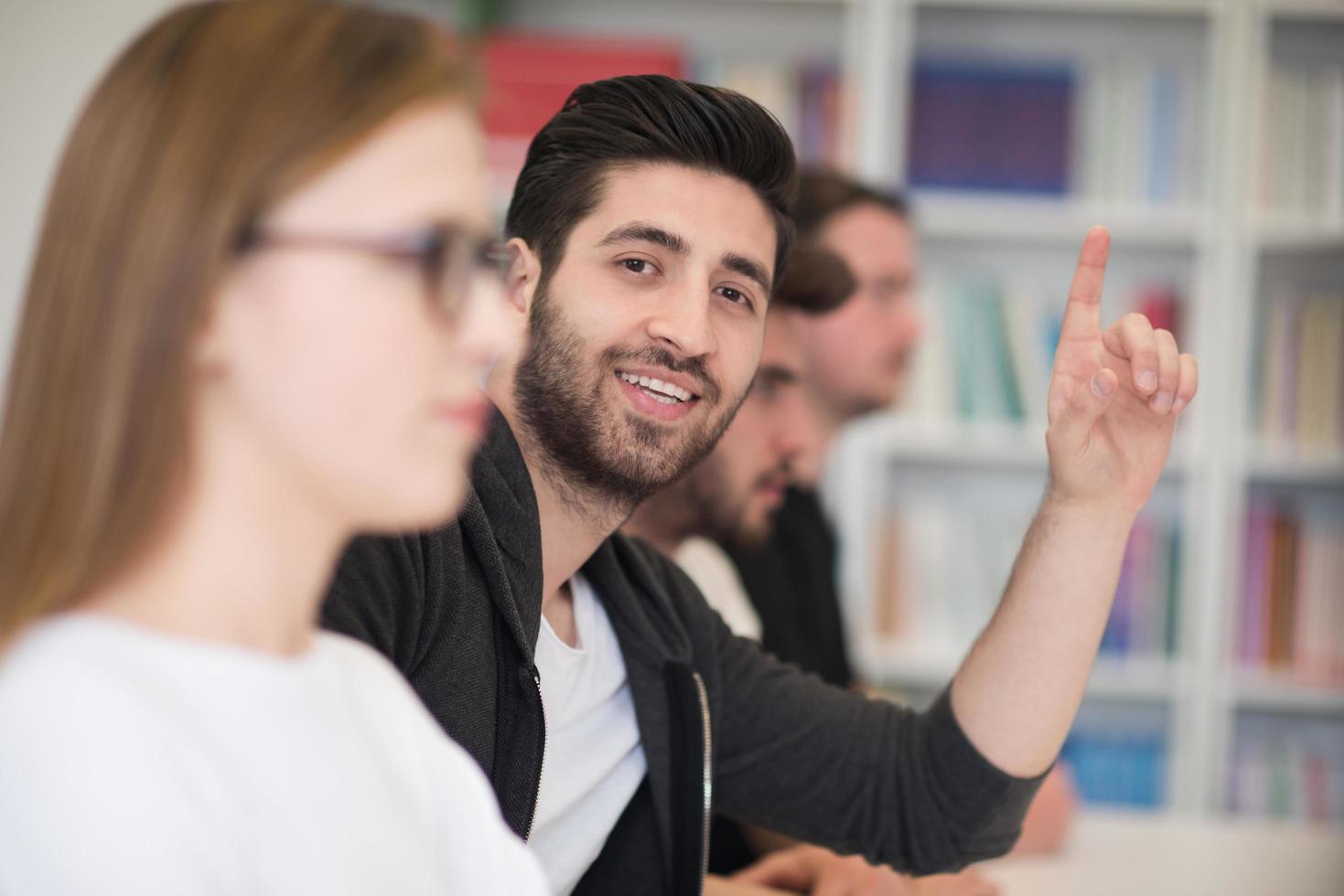 group of students  raise hands up photo