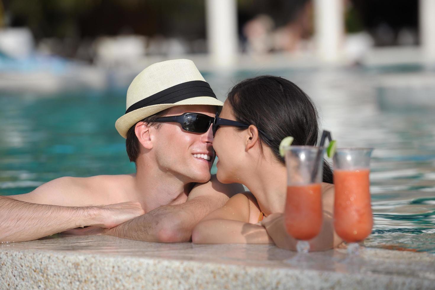 happy young couple have fun on beach photo