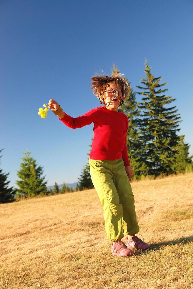 happy child jumping in nature photo