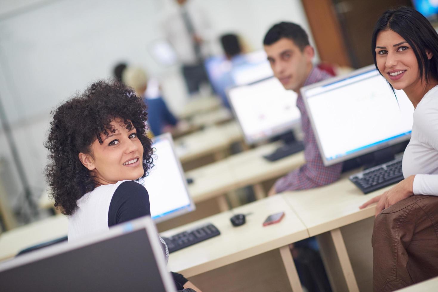 students group in computer lab classroom photo