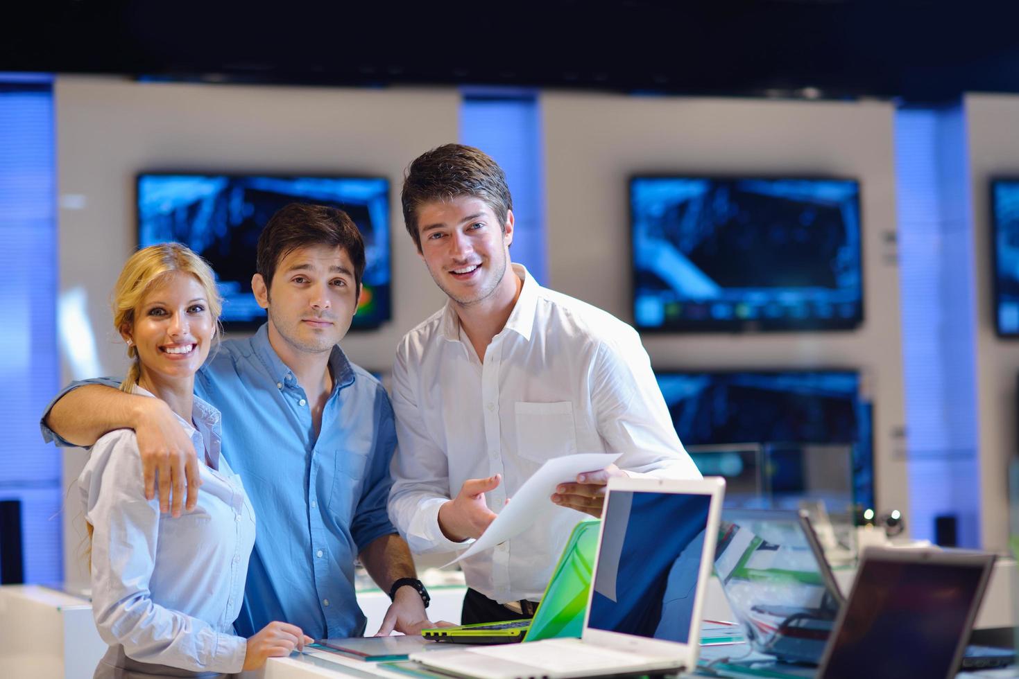 people buy  in consumer electronics store photo