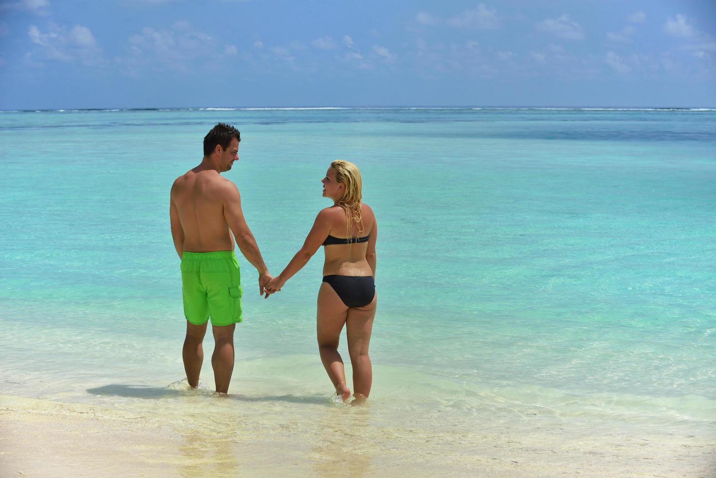 happy young  couple at summer vacation have fun and relax at beach photo