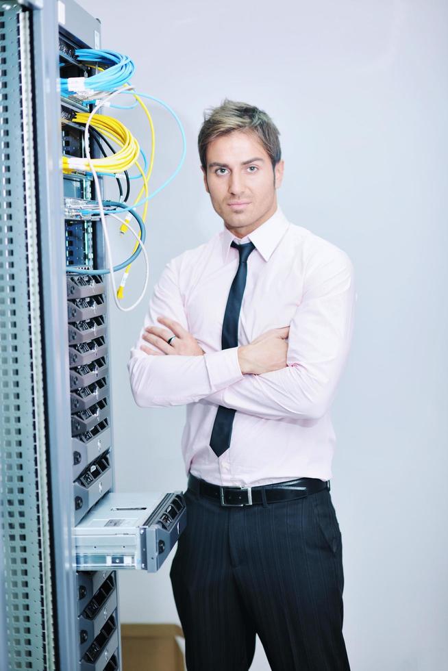 young it engeneer in datacenter server room photo