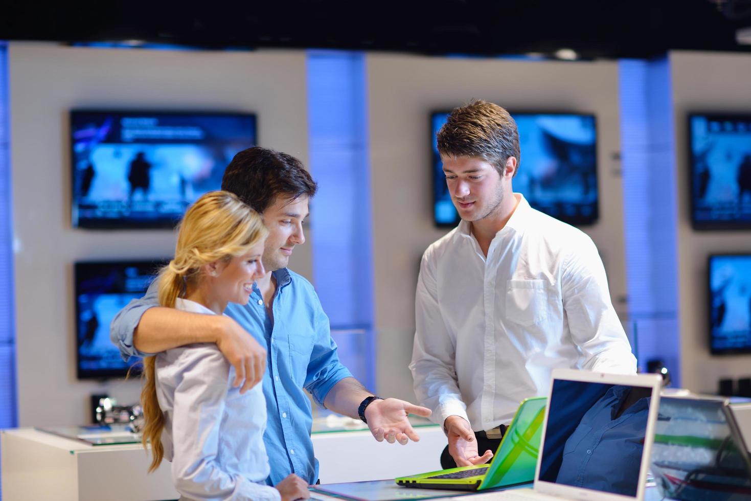 people buy  in consumer electronics store photo