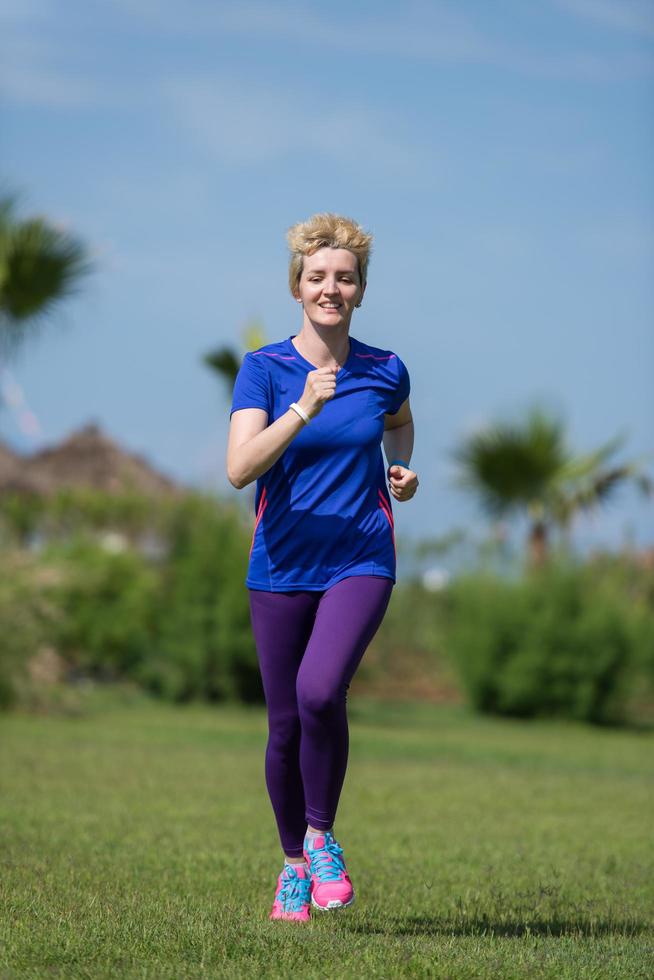 young female runner training for marathon photo