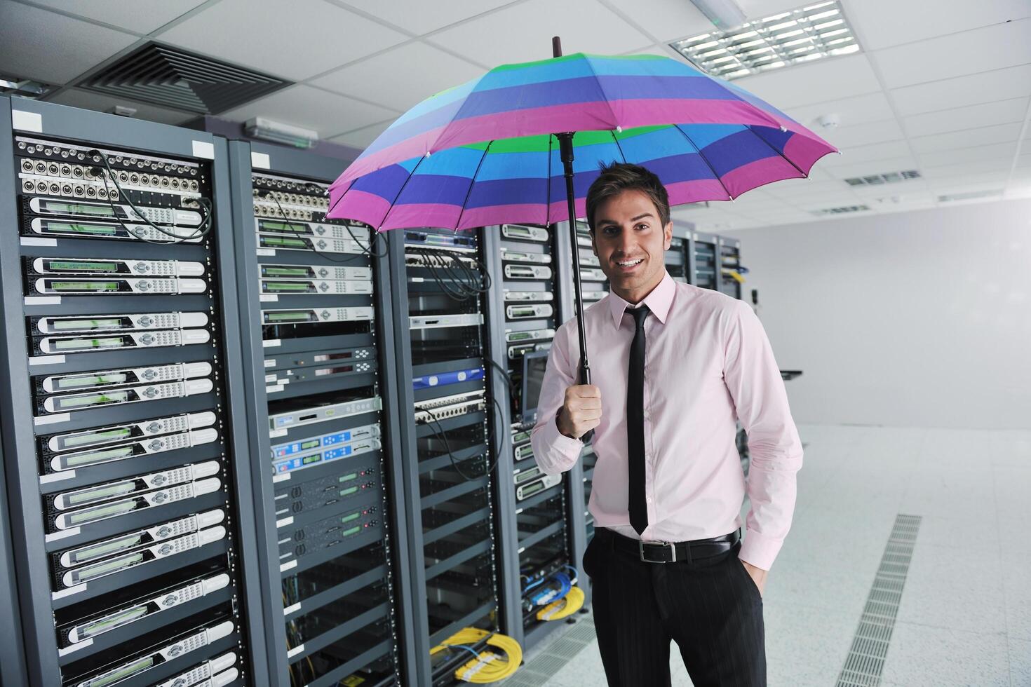 businessman hold umbrella in server room 11930912 Stock Photo at Vecteezy
