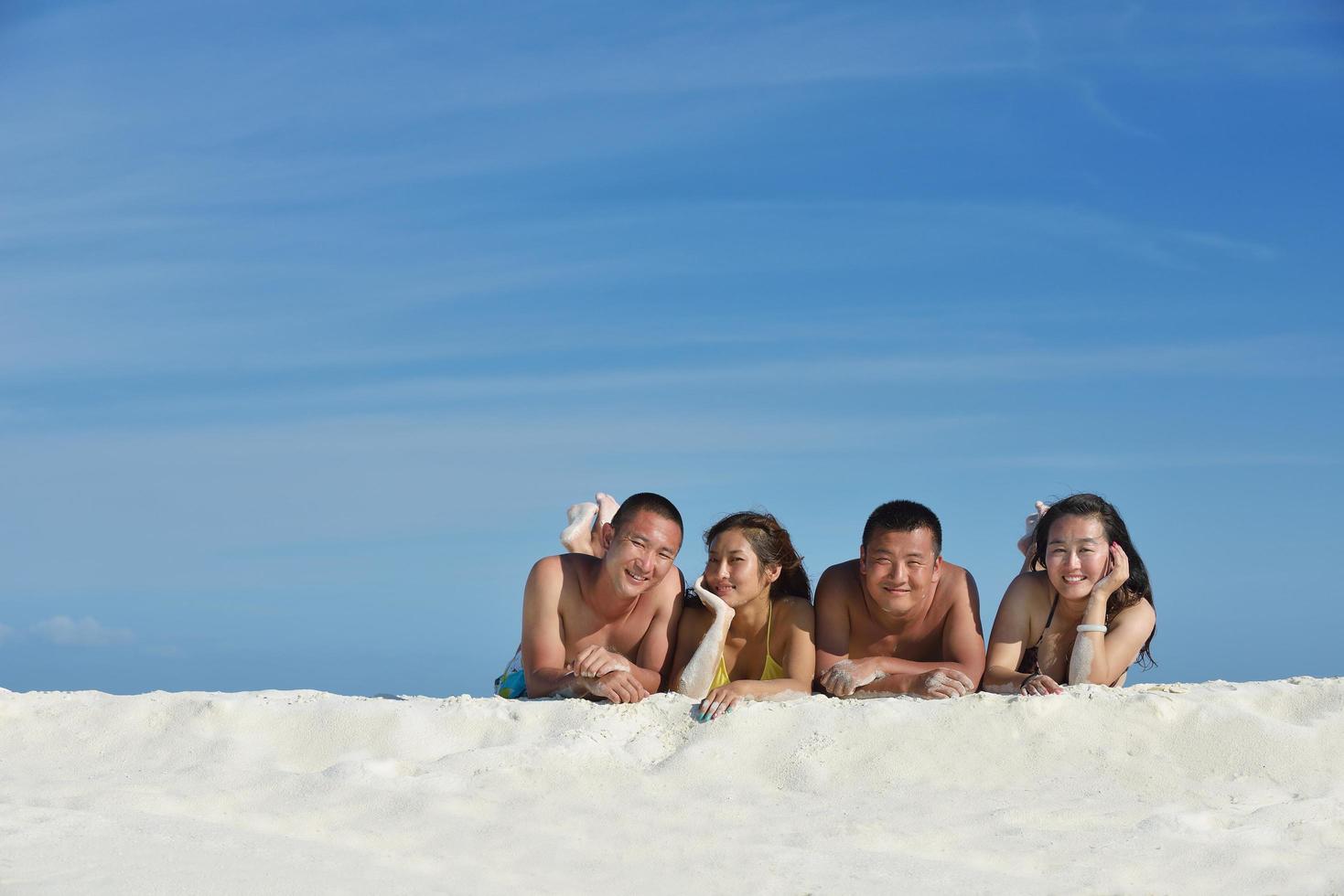 group of happy young people have fun on bach photo