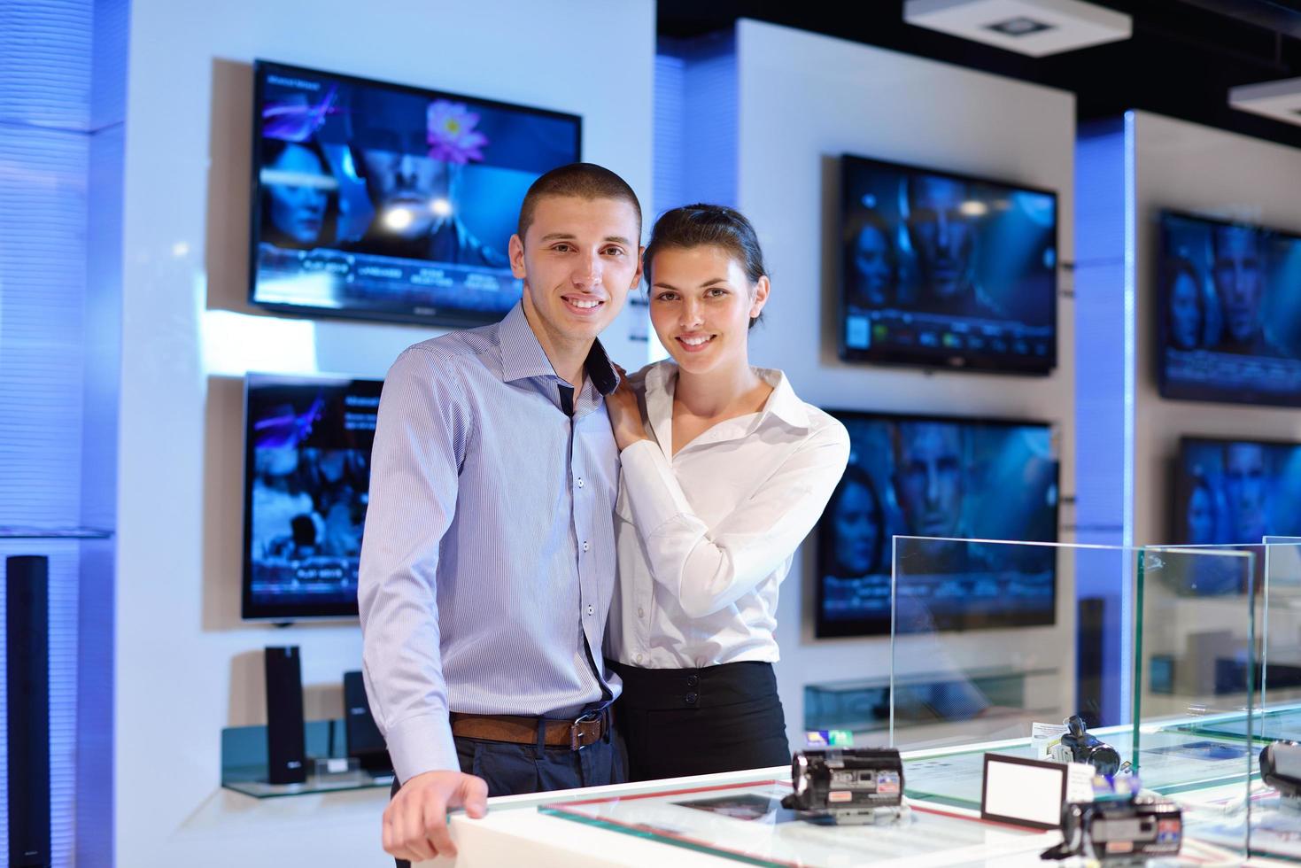 People in electronics store photo