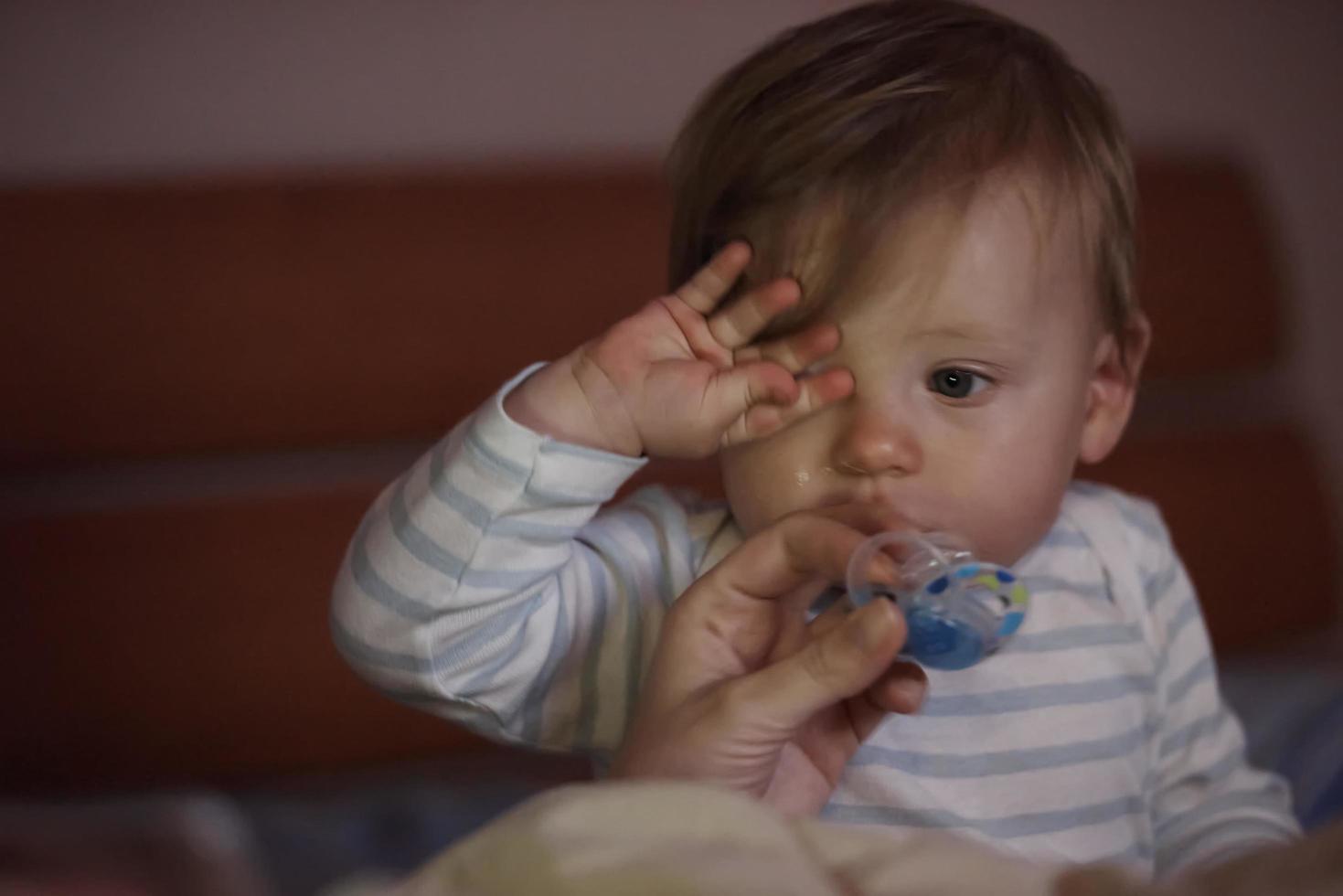 cute  little  baby playing and making first steps photo