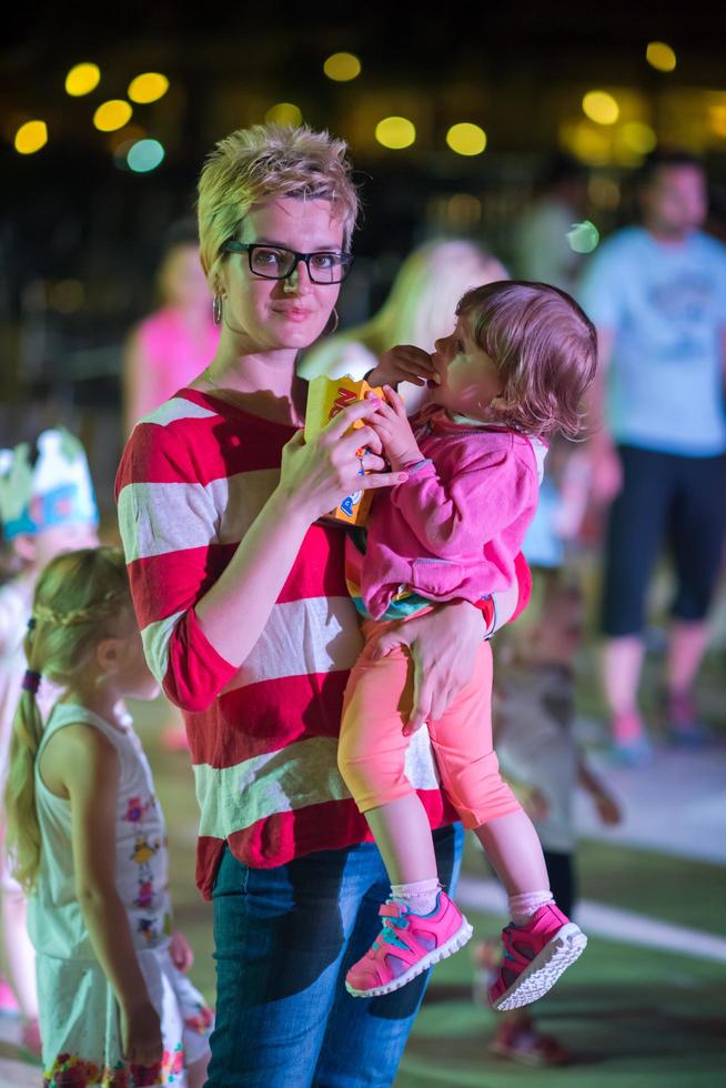 mother and little daughter in the kids disco photo