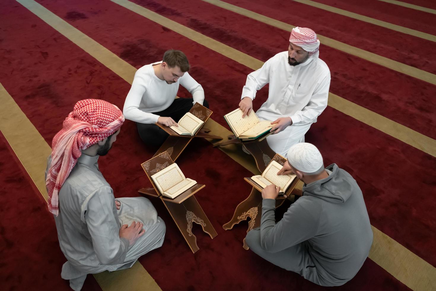 muslim people in mosque reading quran together photo