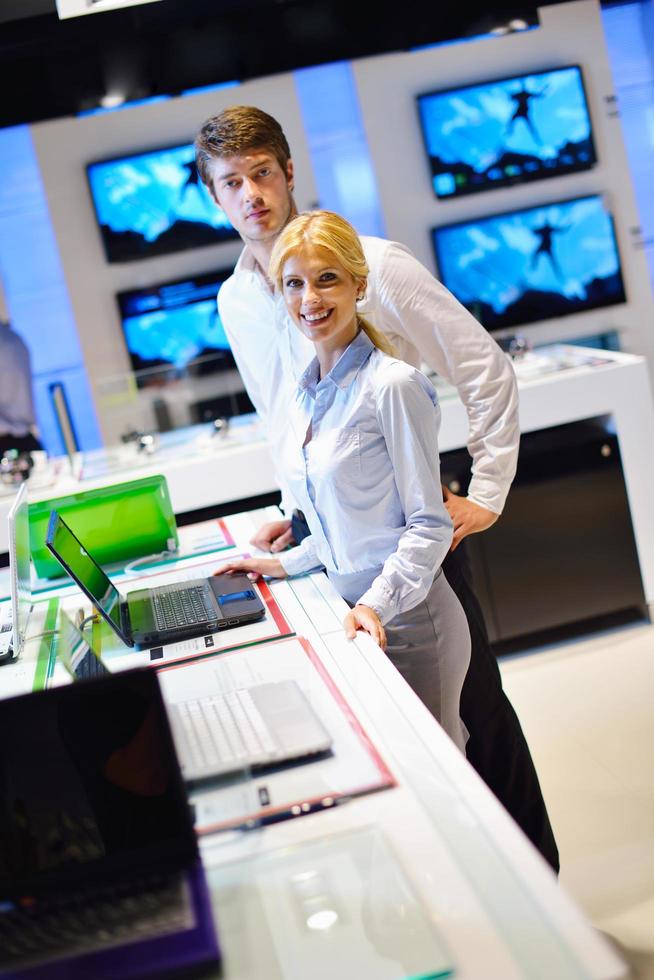 People in electronics store photo