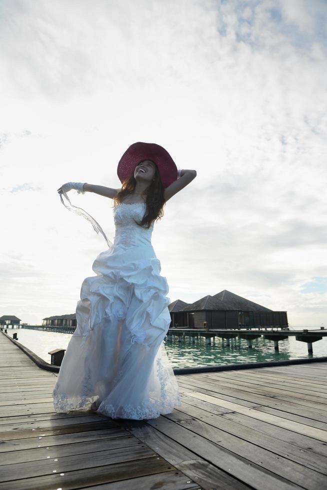 asian bride on beach photo